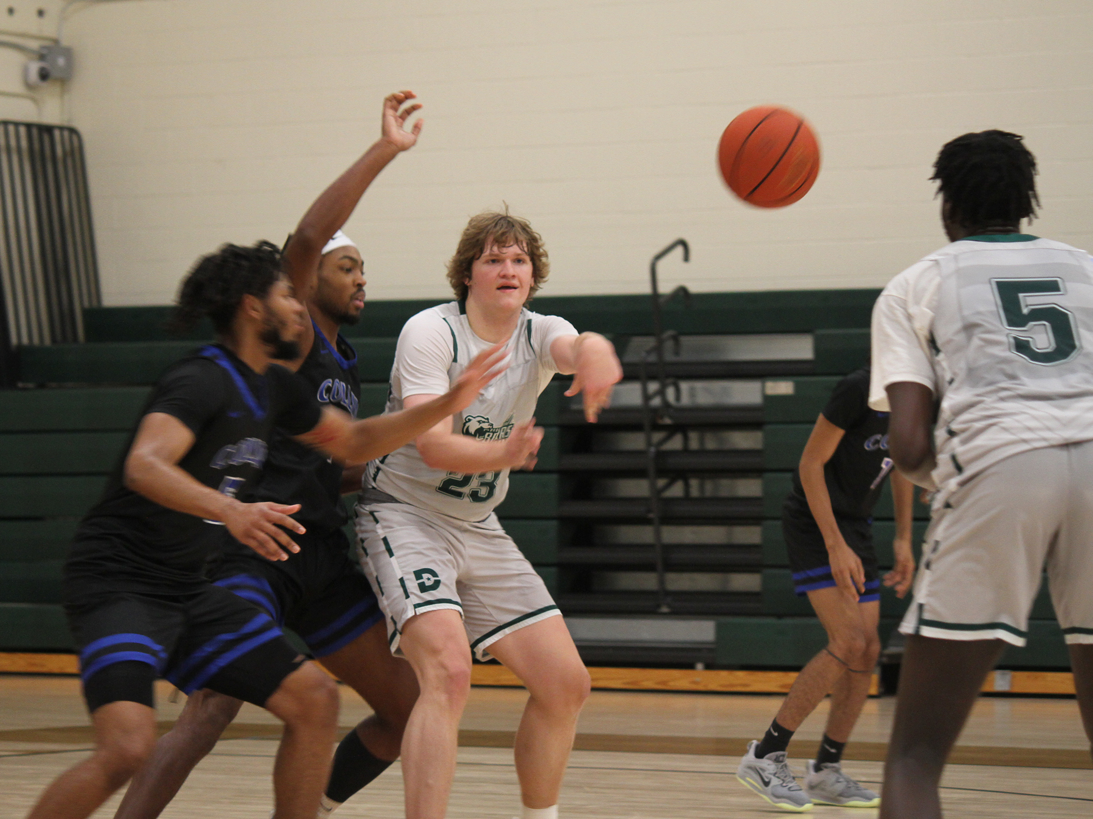 Dallas College Brookhaven men's basketball's Dirk Falkenhagen passes the ball. 